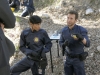 BONES:   Hodgins (TJ Thyne, R) and Cam (Tamara Taylor, L) brief Booth and Aubrey at a crime scene in the first part of the special two-hour "The Lost in the Found"/"The Verdict in the Victims" episode of BONES airing Thursday, May 7 (8:00-10:00 PM ET/PT) on FOX.  ©2015 Fox Broadcasting Co.  Cr:  Jennifer Clasen/FOX