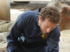 BONES:  Hodgins (TJ Thyne) investigates remains found mysteriously sealed in an impenetrable pod in the "The Bod in the Pod" episode of BONES airing Monday, Nov. 19 (8:00-9:00 PM ET/PT) on FOX.  ©2012 Fox Broadcasting Co.  Cr:  Ray Mickshaw/FOX