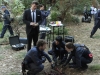 BONES:  Booth (David Boreanaz, L) watches as Brennan (Emily Deschanel, R), Cam (Tamara Taylor, second from R) and Hodgins (TJ Thyne, second from L) investigate the remains of two bodies that were found at the same burial plot in the