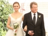 BONES:  Max (guest star Ryan O'Neal, R) walks Brennan (Emily Deschanel, L) down the aisle at her wedding in the "The Woman in White" episode of BONES airing Monday, Oct. 21 (8:00-9:00 PM ET/PT) on FOX.  Â©2013 Fox Broadcasting Co.  Cr:  Patrick McElhenney/FOX