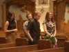 BONES:  Brennan (Emily Deschanel, R), Angela (Michaela Conlin, L) and Hodgins (TJ Thyne, second from L) rehearse for Brennan's wedding with Father Harrow (guest star David Hornsby, second from R) in the "The Woman in White" episode of BONES airing Monday, Oct. 21 (8:00-9:00 PM ET/PT) on FOX.  Â©2013 Fox Broadcasting Co.  Cr:  Patrick McElhenney/FOX
