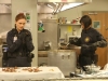 BONES: Brennan (Emily Deschanel, L) and Cam (Tamara Taylor, R) investigate remains that were tossed in a meat grinder and mixed into cans of stew served in a school cafeteria in the "The Mystery in the Meat" episode of BONES airing Friday, Nov. 22 (8:00-9:00 PM ET/PT) on FOX. ©2013 Fox Broadcasting Co.  Cr: Patrick McElhenney/FOX