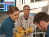BONES:  Canadian Forensic podiatrist Dr. Douglas Filmore (guest star Scott Lowell, C) interns with Brennan (Emily Deschanel, L) in the "The Master in the Slop" episode of BONES airing Friday, Jan. 24 (8:00-9:00 PM ET/PT) on FOX.  Also pictured:  TJ Thyne (R).  ©2013 Fox Broadcasting Co.  Cr:  Patrick McElhenney/FOX