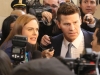 BONES:  Brennan (Emily Deschanel, L) and Booth (David Boreanaz, R) are rushed by the media in the "The Recluse in the Recliner" Season Finale episode of BONES airing Monday, May 19 (8:00-9:00 PM ET/PT) on FOX.  Â©2014 Fox Broadcasting Co.  Cr:  Patrick McElhenney/FOX