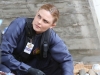 BONES:  Brennan (Emily Deschanel) investigates remains found in a storm drain in the "The Purging of the Pundit" episode of BONES airing Thursday, Oct. 9 (8:00-9:00 PM ET/PT) on FOX.  Â©2014 Fox Broadcasting Co.  Cr:  Patrick McElhenney/FOX