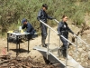 BONES:  Brennan (Emily Deschanel, R) and Cam (Tamara Taylor, C) investigate remains found in a beaver dam in the "The Dude in the Dam" episode of BONES airing Monday, Nov. 11 (8:00-900 PM ET/PT) on FOX.  Â©2013 Fox Broadcasting Company.  Cr:  Ray Mickshaw/FOX